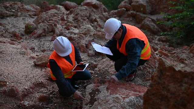 Geologist surveying mine,Explorers collect soil samples to look for minerals.