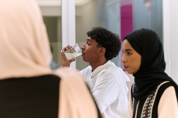 A traditional and diverse Muslim family comes together to share a delicious iftar meal during the sacred month of Ramadan, embodying the essence of familial joy, cultural richness, and spiritual unity