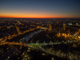 Aerial view of Timisoara, Romania with the city lights and Christmas lights at blue hour