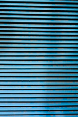 Obraz premium Abstract detail of blue metal slats on a utility closet