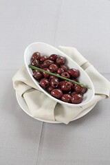 bowl filled with large and delicious olives in olive oil