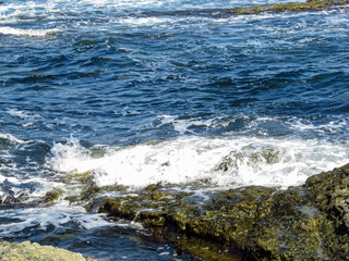 Sea with waves and rocks on the shore