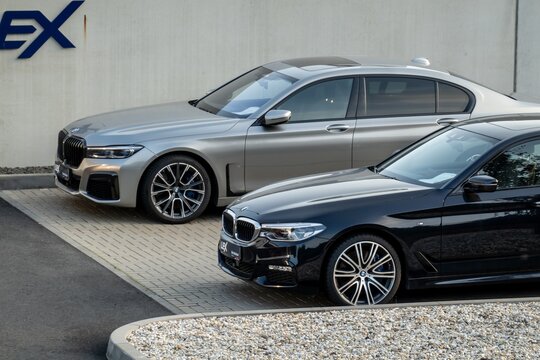 BMW 7-Series luxury saloon of G11 G12 generation in silver colour and BMW 5-Series G30 presented at dealership