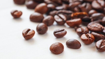 roasted coffee beans close-up on a white background