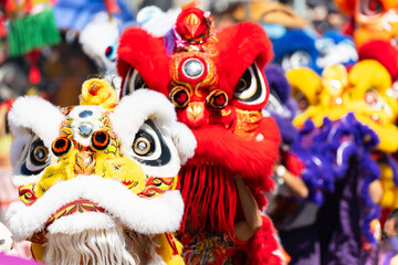 Chinese lion dance show on street in the Chinese New Year festival.Chinese lion costume used during...