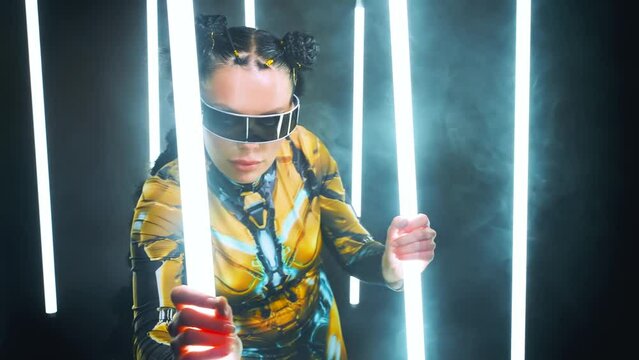 Fantasy cyborg woman creative robot costume glowing glasses metal body cyberpunk style braid hairstyle. Sexy alien girl in virtual reality game lady warrior future holding vr laser sword lamp in hands
