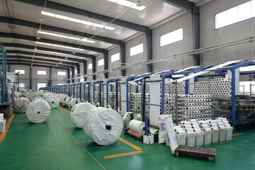 Workers working nervously on the fiber bag production line.