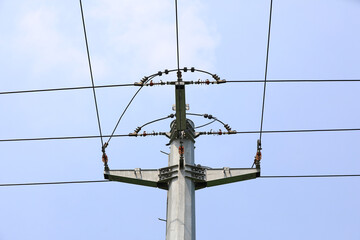 Electric steel poles in the blue sky background