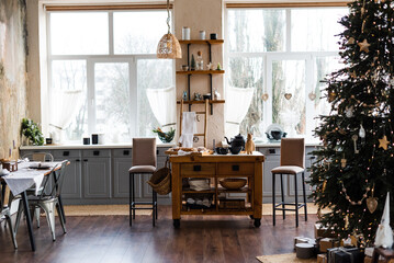 Kitchen with two large windows and a Christmas tree