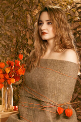 Girl with fesalis. The girl is wrapped in linen cloth. Girl in archaic natural style. The girl and...