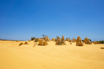 Pinnacles Desert in Western Australia, Nambung National Park, yellow desert, rocks on sand