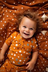 portrait of little smiling laughing baby child in bed cradle
