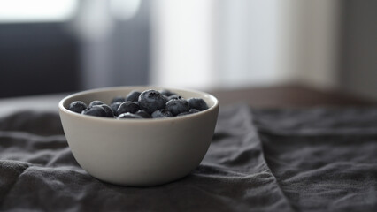washed blueberries in white bowl on table