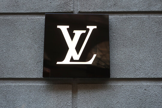 Louis Vuitton logo, signage, emblem on the fashion store facade. KYIV, UKRAINE - AUGUST 8, 2021