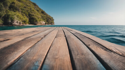 Fototapeta premium Empty wooden table on the background of the sea, island and blue sky. High quality photo, blurred bokeh. for display of assembly products, space for text