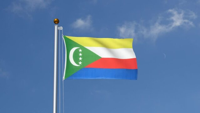 Comoros flag flying on a flagpole