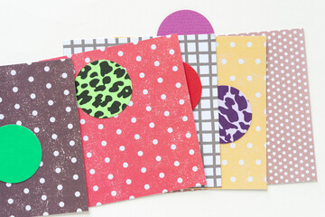 layered cards with patterns and paper circles with solids and spots