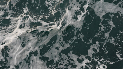 blue water sea surface with soft summer light closeup