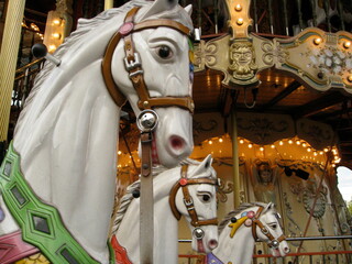 Three horses on a carousel in Paris.