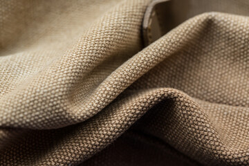 Sand colored fabric surface for clothing production, brown fabric