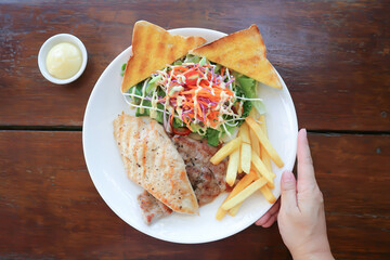 pork steak and chicken steak with French fries ,bread and salad or grilled pork and grilled chicken