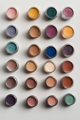 Top view of a lot of colorful eye shadow on a white background. Cosmetics and beauty concepts.