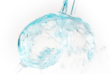 Natural water falling into a glass cristal