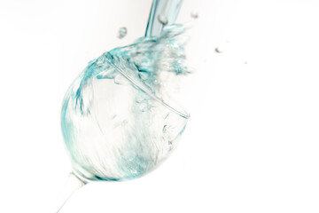 Natural water falling into a glass cristal