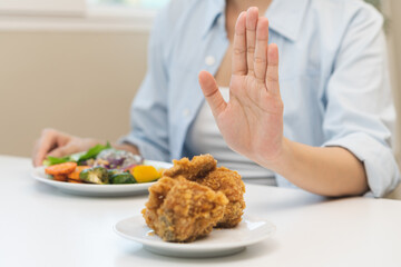 Diet, Dieting asian young woman hand push out, reject fried chicken on plate, deny to eat fast,...