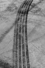 Tire track mark on asphalt tarmac road race track texture and background, Abstract background black...