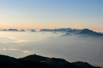 Panoramic sunrise view from Dobratsch on Julian Alps and Karawanks in Austria, Europe. Silhouette...