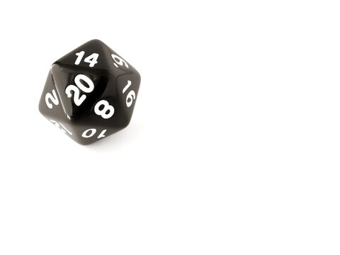 A black D20 twenty sided dice isolated on white. RPG dice. Icosahedron DND dice and copy space to add text 