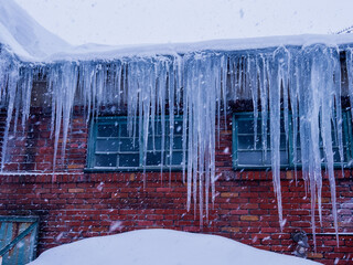 icicles hanging on a roof