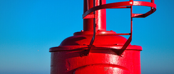 Red small lighthouse located in Marina di Ravenna