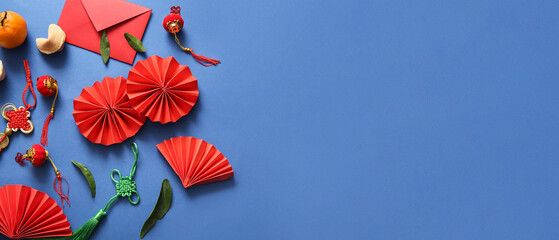 Composition with Chinese fans, red envelope and symbols on blue background. Banner for design