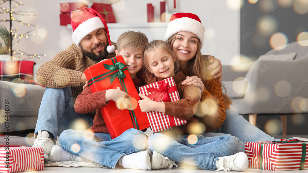 Sticker happy parents and their little children with christmas presents at home