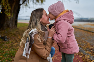 In candid pauses, the mother and daughter share hugs and kisses, creating cherished memories amid...