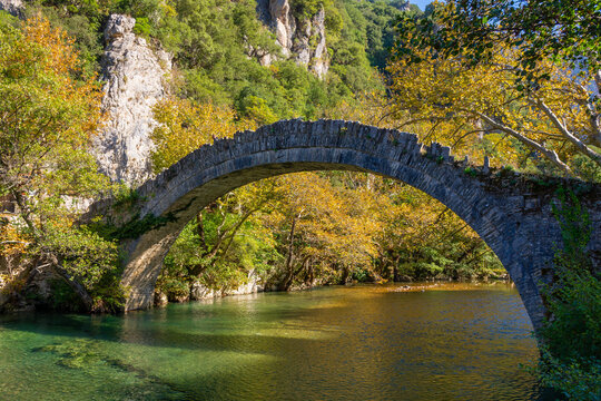 Stone Bridge of Kleidonia. This stone bridge with its unique arch is situated near the village of Kleidonia at the end of Vikos Gorge in Zagori, Epirus, Greece. Old Arch Bridge over Voidomatis River.