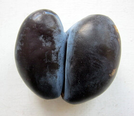 funny blue plum in the shape of a heart

