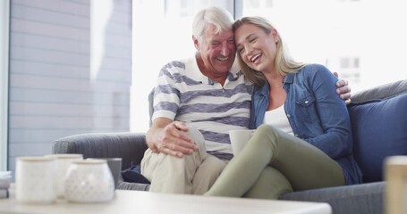 Father, daughter or conversation love on sofa or coffee parenting support, quality time or bonding. Man, woman or hot drink smile for storytelling together or communication joke, rest trust in lounge