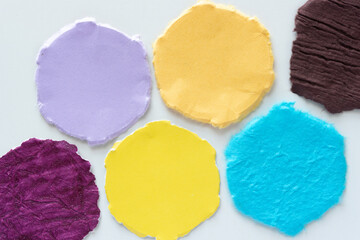 torn hexagonal paper shapes on blank paper