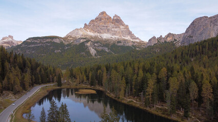 Fototapeta premium Alpine Elegance: A Stunning Aerial Perspective of Dolomite Lake and Peaks