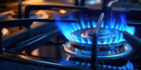 Foto auf Acrylglas Close up view of blue flames on a gas stove. Ideal for illustrating concepts of cooking, heating, or energy efficiency © Fotograf