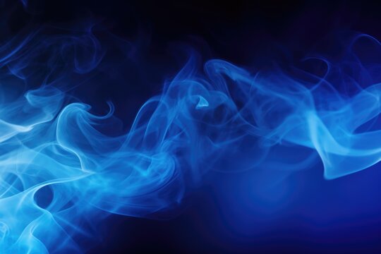Close up view of blue smoke on a black background. This image can be used for various purposes