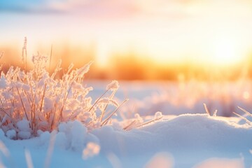 A picturesque snowy field with the sun setting in the background. Ideal for winter landscapes or nature-themed projects
