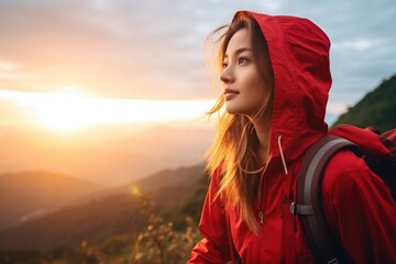 A woman wearing a red jacket and carrying a backpack. Suitable for travel, hiking, and outdoor lifestyle themes - Powered by Adobe