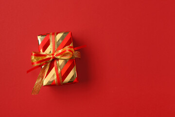Christmas gift box on red background