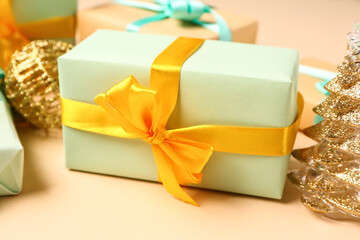Gift boxes and Christmas decorations on yellow background