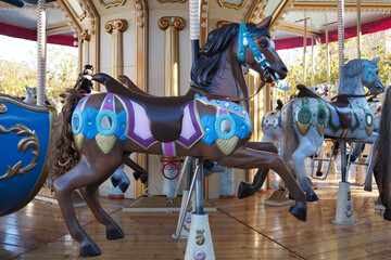 Fototapeta na wymiar black horse on a carousel