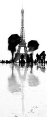 silhouette of tourists moving  eiffel tower